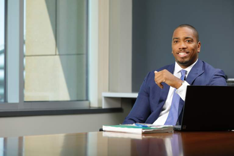 successful African American attorney in his office